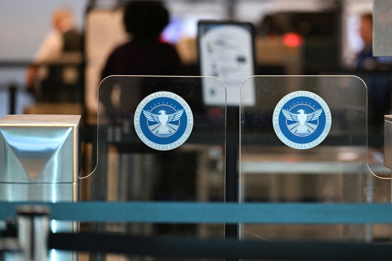 FILE PHOTO: A Transportation Security Administration (TSA) gate at Ronald Reagan Washington National Airport in Arlington, Virginia, U.S., February 14, 2026. REUTERS/Annabelle Gordon/File Photo