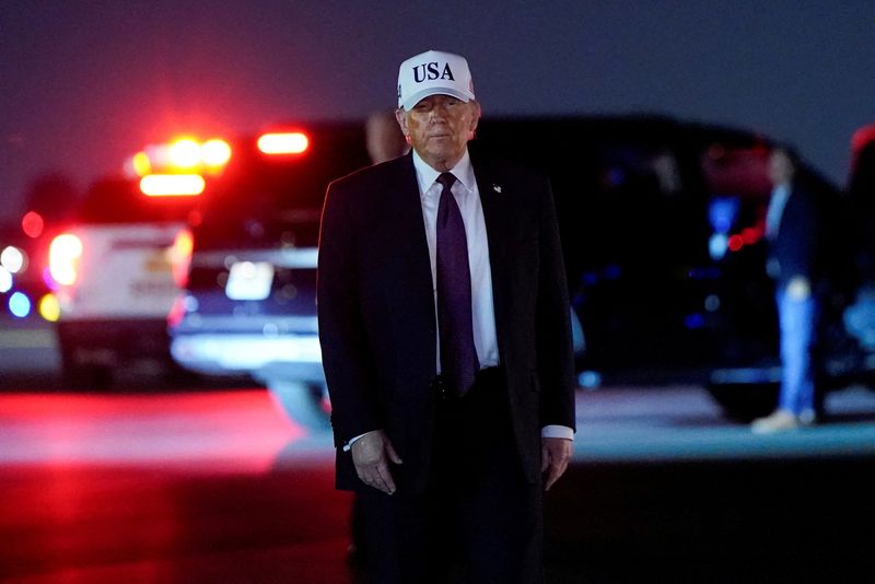 U.S. President Donald Trump looks on after disembarking Air Force One at Palm Beach International Airport in West Palm Beach, Florida, U.S., February 27, 2026. REUTERS/Elizabeth Frantz