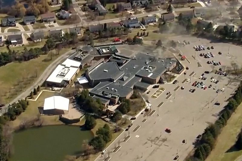 Smoke rises from the building after the Michigan State Police reported an active shooting incident at the Temple Israel Synagogue in West Bloomfield, Michigan, U.S., March 12, 2026 in a still image from video.   ABC Affiliate WXYZ via REUTERS.