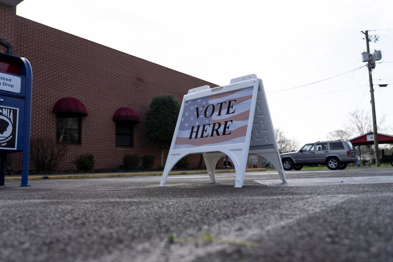 A voting sign is displayed at the entrance of a voting precinct during a special election in Georgia to fill a seat in its 14th congressional district, which was left vacant when Republican Representative Marjorie Taylor Greene resigned in January, in Dalton, Georgia, U.S. March 10, 2026. REUTERS/Alyssa Pointer