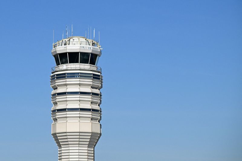 FILE PHOTO: A control tower at Ronald Reagan Washington National Airport in Arlington, Virginia, U.S., February 14, 2026. REUTERS/Annabelle Gordon/File Photo