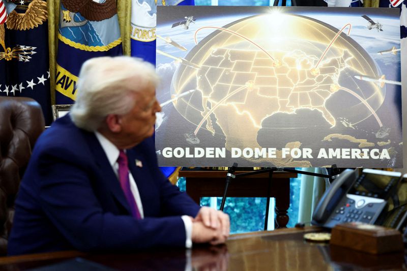 FILE PHOTO: U.S. President Donald Trump looks on as he makes an announcement regarding the Golden Dome missile defense shield with U.S. Defense Secretary Pete Hegseth (not pictured) in the Oval Office of the White House in Washington, D.C., U.S., May 20, 2025. REUTERS/Kevin Lamarque/File Photo
