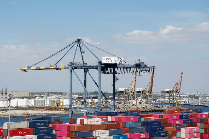 Shipping containers are stacked at a terminal at the port of Los Angeles in Long Beach, California, U.S., March 10, 2026. REUTERS/Caroline Brehman