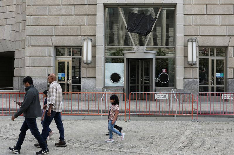 A black plastic shroud covers the signage on the windows of the former offices of the U.S. Agency for International Development (USAID) at the Ronald Reagan Building and International Trade Center in Washington, D.C., U.S., April 24, 2025. REUTERS/Jonathan Ernst