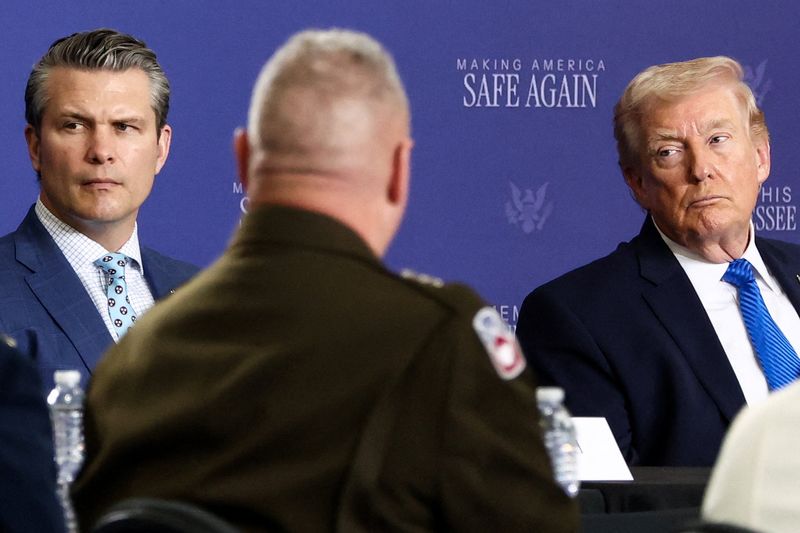 U.S. President Donald Trump and Defense Secretary Pete Hegseth attend a roundtable on public safety at Memphis Air National Guard Base in Memphis, Tennessee, U.S., March 23, 2026. REUTERS/Kevin Lamarque