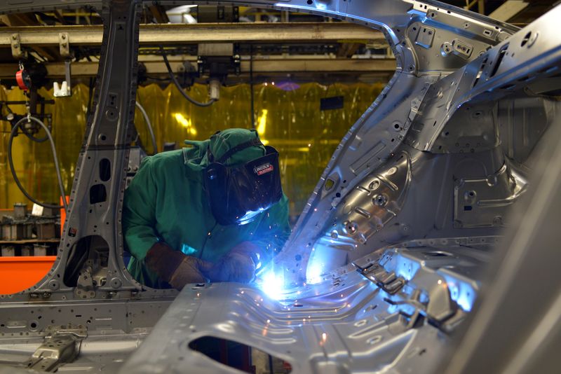 FILE PHOTO: Line workers spot weld parts of the frame on the flex line at an automobile manufacturing plant in Smyrna, Tennessee, U.S., August 23, 2018. REUTERS/William DeShazer/File Photo