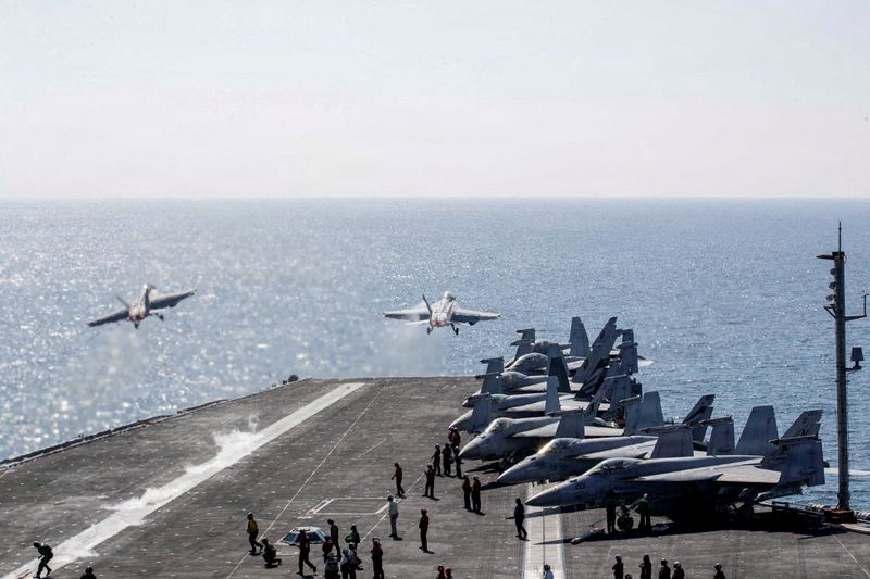 FILE PHOTO: Two F/A-18 Super Hornets launch from the flight deck of the U.S. Navy Nimitz-class aircraft carrier USS Abraham Lincoln in support of the Operation Epic Fury attack on Iran from an undisclosed location March 3, 2026. U.S. Navy/Handout via REUTERS  THIS IMAGE HAS BEEN SUPPLIED BY A THIRD PARTY/File Photo