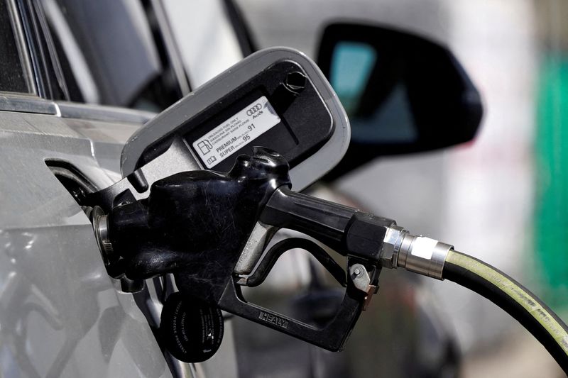 FILE PHOTO: A gas pump is inserted inside an Audi vehicle at a Mobil gas station in Beverly Boulevard in West Hollywood, California, U.S., March 10, 2022. REUTERS/Bing Guan/File Photo