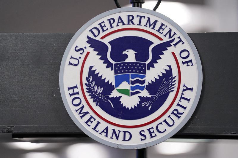 The U.S. Department of Homeland Security seal is displayed ahead of an expected press conference held by U.S. Homeland Security Secretary Kristi Noem at the FEMA National Response Coordination Center in Washington, D.C., U.S., January 24, 2026. REUTERS/Nathan Howard.