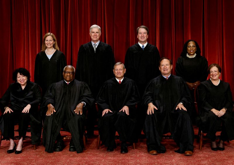 FILE PHOTO: U.S. Supreme Court justices pose for their group portrait at the Supreme Court in Washington, U.S., October 7, 2022. Seated (L-R): Justices Sonia Sotomayor, Clarence Thomas, Chief Justice John G. Roberts, Jr., Samuel A. Alito, Jr. and Elena Kagan. Standing (L-R): Justices Amy Coney Barrett, Neil M. Gorsuch, Brett M. Kavanaugh and Ketanji Brown Jackson. REUTERS/Evelyn Hockstein/File Photo
