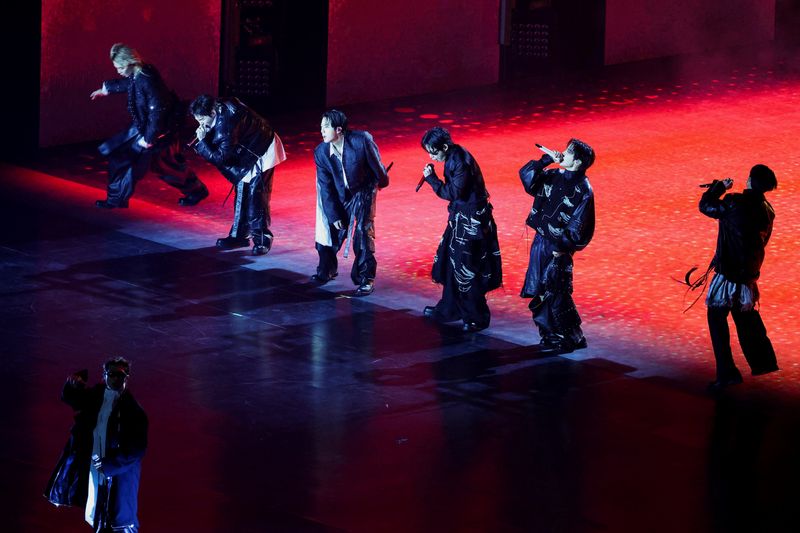 FILE PHOTO: Kpop group BTS perform during ‘BTS The Comeback Live Arirang’ concert in central Seoul, South Korea, March 21, 2026. REUTERS/Kim Hong-ji/Pool EDITORIAL USE ONLY./File Photo
