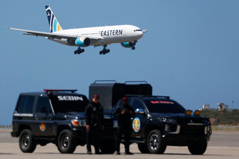 A plane carrying Venezuelan migrants deported from the United States approaches landing at Simon Bolivar International Airport, in Maiquetia, Venezuela, January 19, 2026. REUTERS/Marco Bello