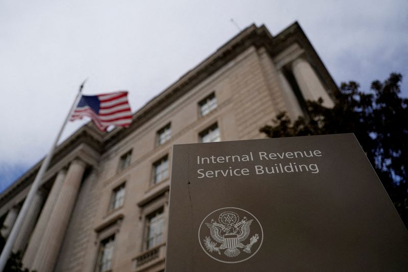 FILE PHOTO: A flag waves outside the International Revenue Service Building in Washington, D.C., U.S., February 18, 2025. REUTERS/Kent Nishimura/File Photo