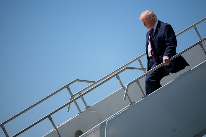 U.S. President Donald Trump disembarks Air Force One, as he arrives at Phoenix Sky Harbor International Airport in Phoenix, Arizona, U.S., April 17, 2026. REUTERS/Evan Vucci