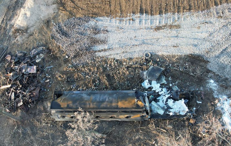 A burnt container is seen at the site where toxic chemicals were spilled following a train derailment, in East Palestine, Ohio, U.S., February 15, 2023. REUTERS/Alan Freed