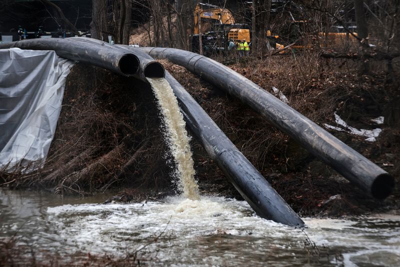 Temporary pipes divert sewage into the C&O Canal in order to repair the Potomac Interceptor, a six-foot-wide wastewater pipe which collapsed in January, dumping hundreds of millions of gallons of sewage into the Potomac River, in Cabin John, Maryland, U.S., February 18, 2026.  REUTERS/Evelyn Hockstein