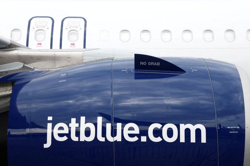 FILE PHOTO: JetBlue logo is seen on an Airbus A321LR at the 54th International Paris Airshow at Le Bourget Airport near Paris, France, June 20, 2023. REUTERS/Benoit Tessier/File Photo