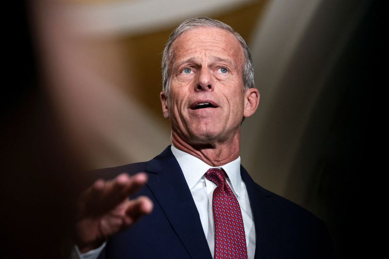 Senate Majority Leader John Thune (R-SD) speaks to a reporter as Senate Republican leaders hold a press conference following their weekly policy lunch on Capitol Hill in Washington, D.C., U.S., April 14, 2026. REUTERS/Evelyn Hockstein/File Photo