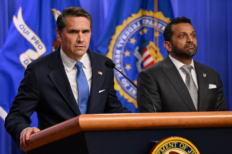 Acting U.S. Attorney General Todd Blanche speaks as Federal Bureau of Investigation (FBI) Director Kash Patel stands by his side during a press conference at the Department of Justice in Washington, D.C., U.S., April 21, 2026. REUTERS/Annabelle Gordon