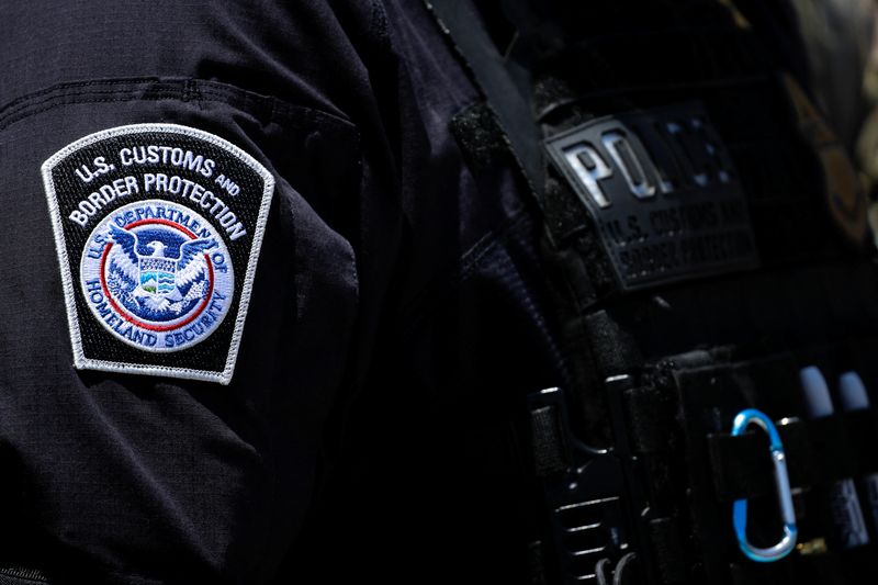 A view shows a patch of the U.S. Customs and Border Protection on the uniform of an officer in downtown Los Angeles, California, U.S., June 10, 2025.   REUTERS/Mike Blake