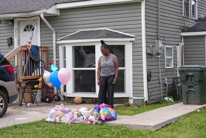 A makeshift memorial with balloons and stuffed animals outside a house where eight children, aged between 1 and 14, were killed in a mass shooting described by authorities as domestic violence, in Shreveport, Louisiana, U.S., April 20, 2026. REUTERS/Arafat Barbakh