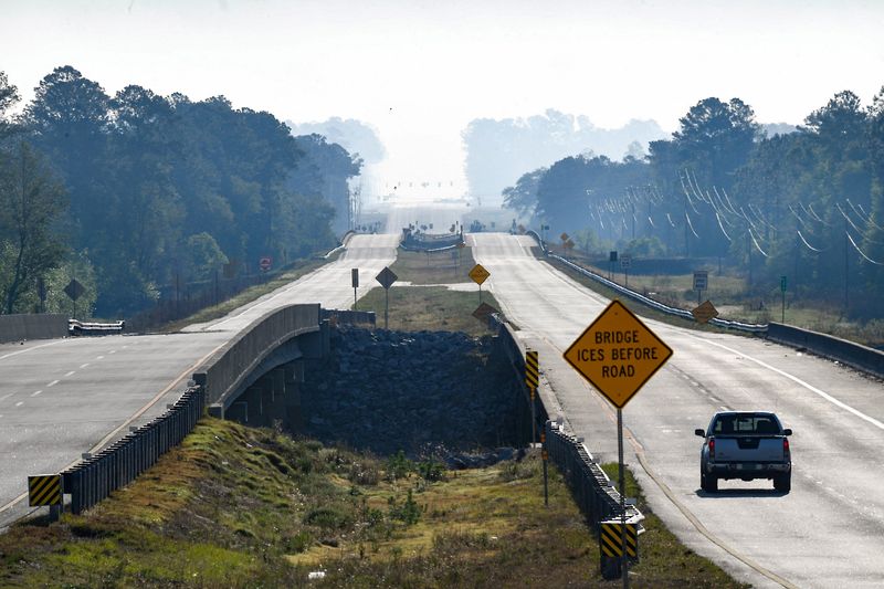 Smoke rises over U.S. Route 82, as a wildfire continues to burn across Brantley County, in Lulaton, Georgia, U.S., April 23, 2026. REUTERS/Octavio Jones