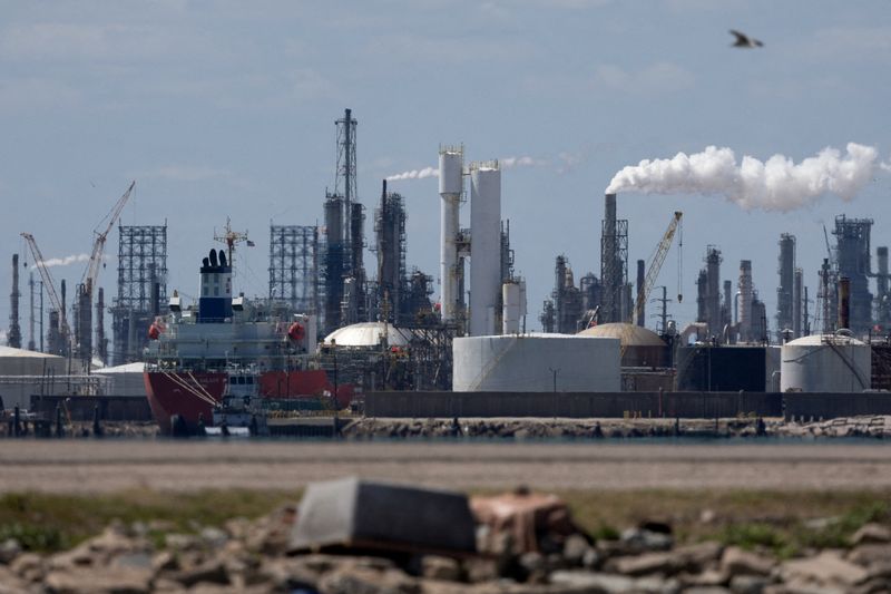 FILE PHOTO: The Rishiri Galaxy, an oil and chemical tanker sailing under the flag of Panama, at left, is docked at the Texas City docks next to the Marathon Galveston Bay Refinery shortly after U.S. President Donald Trump announced a 60-day waiver of the Jones Act shipping law, in Texas City, Texas, U.S. March 18, 2026.  REUTERS/Antranik Tavitian/File Photo