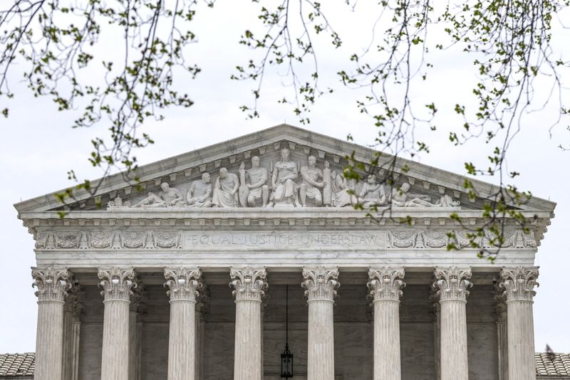 FILE PHOTO: The U.S. Supreme Court building during proceedings in pending appeals at the Supreme Court in Washington, D.C., U.S., March 30, 2026. REUTERS/Evelyn Hockstein/File Photo