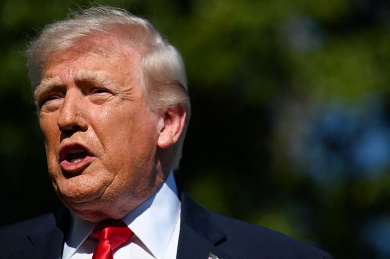 U.S. President Donald Trump speaks to the press, as he departs from the White House, en route to Joint Base Andrews (JBA), in Washington, D.C., U.S., April 11, 2026. REUTERS/Annabelle Gordon