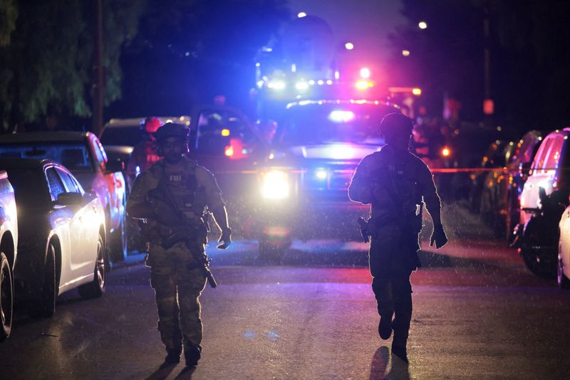 FBI agents walk outside residence associated with Cole Tomas Allen, the suspect in the shooting incident at the annual White House Correspondents' Association dinner in Washington, D.C., in Torrance, California, U.S., April 25, 2026.  REUTERS/Daniel Cole