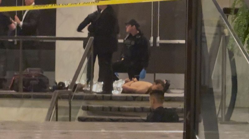 Cole Tomas Allen, a suspect in the shooting incident at the White House Correspondents' Association dinner, lies on the floor after being detained by law enforcement personnel, in Washington, D.C., U.S., April 25, 2026, in this screengrab from a video. Bill Frischling/ CQ Roll Call/Handout via REUTERS