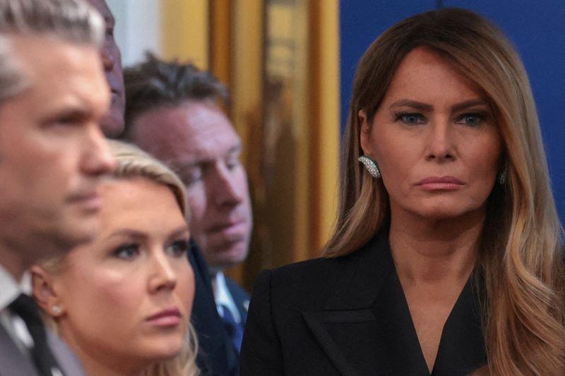 First lady Melania Trump looks on next to White House Press Secretary Karoline Leavitt and U.S. Secretary of Defense Pete Hegseth as U.S. President Donald Trump holds a press briefing at the White House, following a shooting incident during the annual White House Correspondents’ Association dinner, in Washington, D.C., U.S., April 25, 2026 REUTERS/Jonathan Ernst