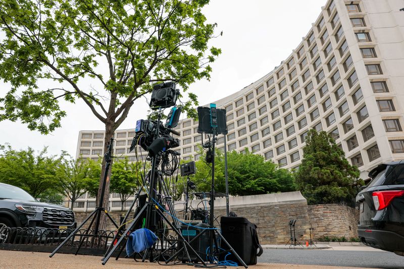 Media broadcasting equipment is placed on a sidewalk near the Washington Hilton hotel, where a shooting incident occurred yesterday night at the annual White House Correspondents' Association dinner, in Washington, D.C., U.S., April 26, 2026. REUTERS/Kylie Cooper