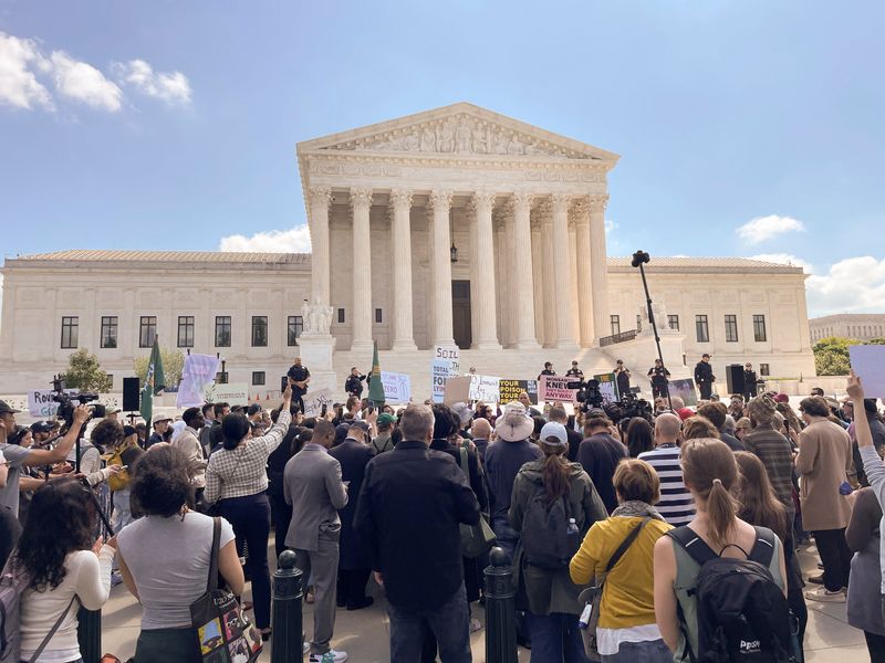 People who support the "Make America Healthy Again" movement rally against Bayer, the maker of Roundup weedkiller, outside the U.S. Supreme Court on the day the justices heard arguments in the German company’s effort to shut down thousands of lawsuits accusing it of failing to warn users that the active ingredient in this product allegedly causes cancer, in Washington, D.C., U.S., April 27, 2026. Picture taken with a phone. REUTERS/Leah Douglas