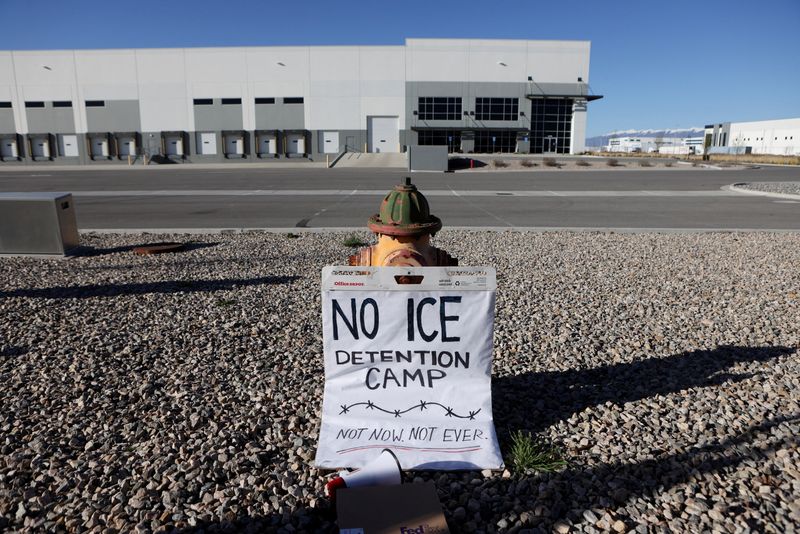 FILE PHOTO: A placard is placed on the ground near a warehouse where people protest as it is purchased by U.S. Immigration and Customs Enforcement (ICE) for use as a detention center in Salt Lake City, Utah, U.S. March 18, 2026.  REUTERS/Jim Urquhart/File Photo