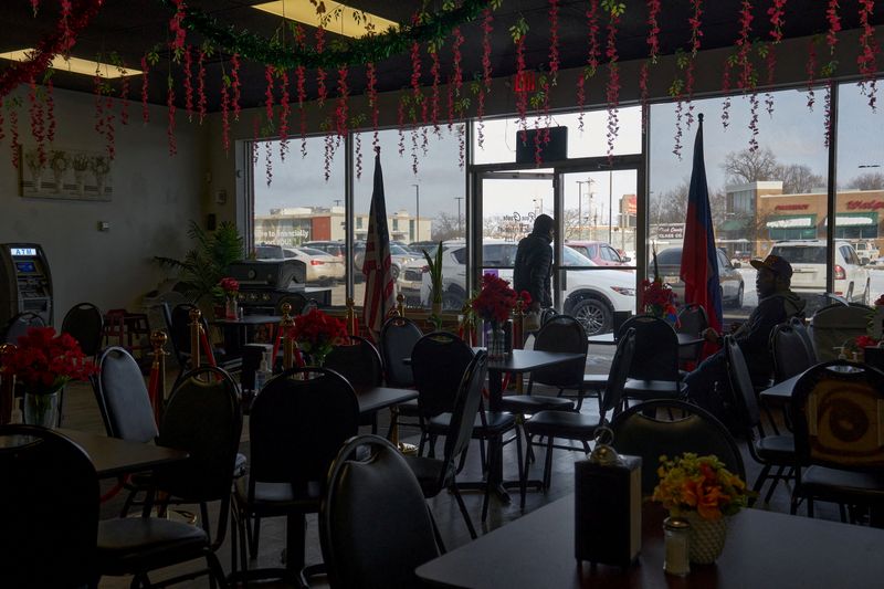 A customer exits Rose Goute Creole Restaurant, a Haitian restaurant, after a federal judge issued a temporary stay blocking the Trump administration’s attempt to strip Temporary Protected Status (TPS) for Haitian immigrants, in Springfield, Ohio, U.S., February 4, 2026. REUTERS/Bing Guan