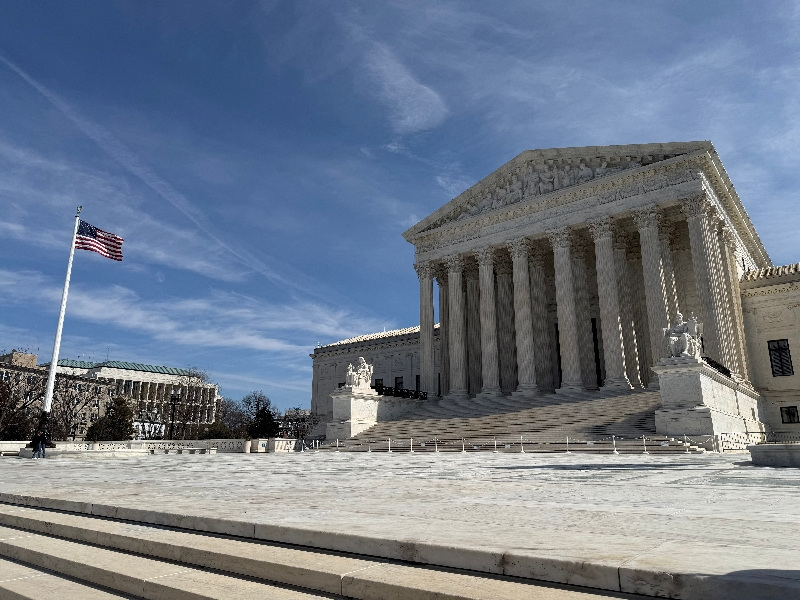 FILE PHOTO: A U.S. flag flutters outside the U.S. Supreme Court building in Washington, D.C., U.S. March 14, 2026. REUTERS/Will Dunham/File Photo