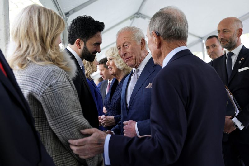 Britain's King Charles standing next to Queen Camilla interacts with New York City Mayor Zohran Mamdani during a visit to the 9/11 Memorial, in New York City, U.S., April 29, 2026. REUTERS/Jeenah Moon/Pool
