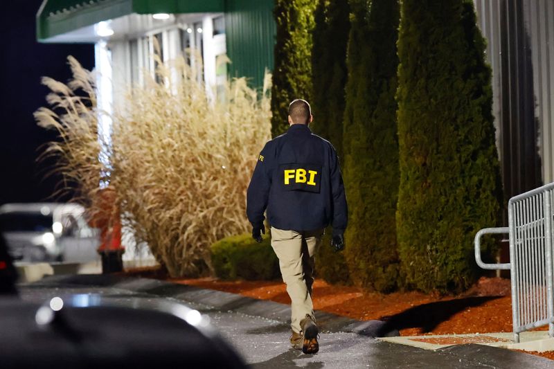 An investigator works the scene at a storage facility where the Brown University shooter, identified by authorities as Claudio Neves Valente, took his own life, in Salem, New Hampshire, U.S., December 18, 2025.   REUTERS/CJ Gunther