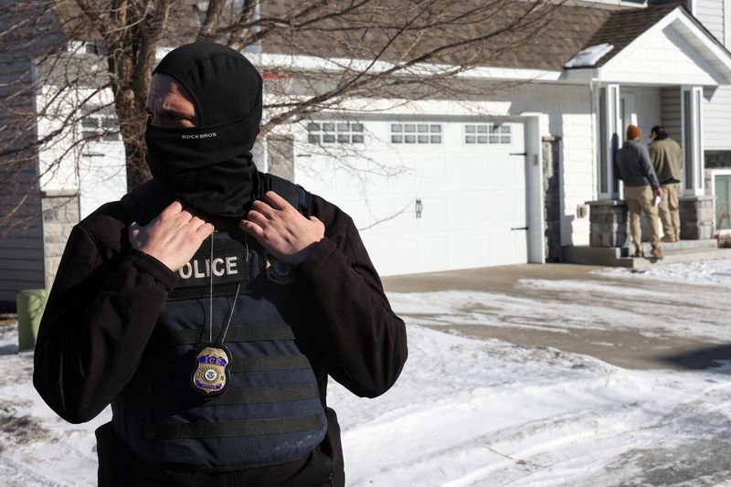 Federal agents with U.S. Immigration and Customs Enforcement (ICE) conduct an immigration enforcement operation in Pine Grove, Minnesota, U.S., January 28, 2026. REUTERS/Shannon Stapleton