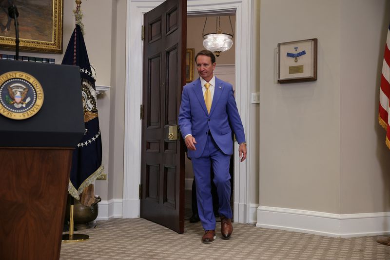 Governor of Louisiana Jeff Landry walks, in the Roosevelt Room at the White House, in Washington, D.C., U.S., March 24, 2025. REUTERS/Carlos Barria