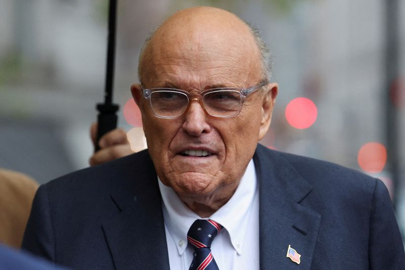FILE PHOTO: Former Donald Trump lawyer and former New York City Mayor Rudolph Giuliani arrives at U.S. Federal court in his case to surrender valuables to Georgia election workers he was found to have defamed, in New York City, U.S., November 26, 2024. REUTERS/Brendan McDermid/File Photo