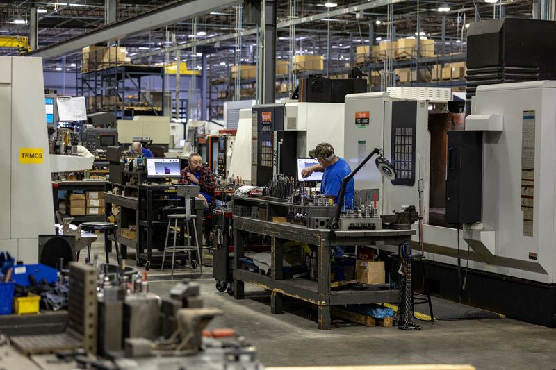 Employees work on the production floor of the General Stamping & Metalworks building in South Bend, Indiana, U.S., March 23, 2026. REUTERS/Jim Vondruska/File Photo