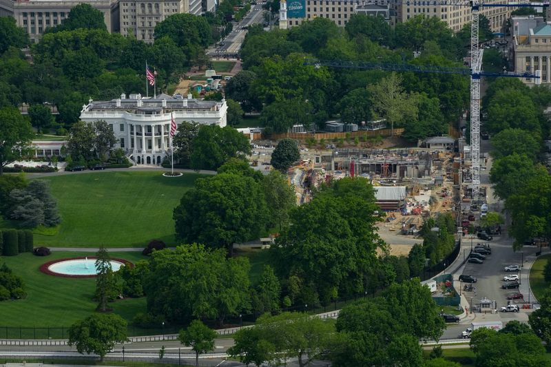 Aerial view from the top of the Washington Monument shows construction crews as they continue site preparation for a planned White House ballroom in the area of the former East Wing in Washington, D.C., U.S., May 2, 2026. REUTERS/Ken Cedeno