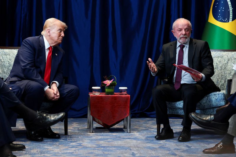 U.S. President Donald Trump listens to Brazilian President Luiz Inacio Lula da Silva speak as they meet on the sidelines of the 47th Association of Southeast Asian Nations (ASEAN) summit in Kuala Lumpur, Malaysia, October 26, 2025. REUTERS/Evelyn Hockstein