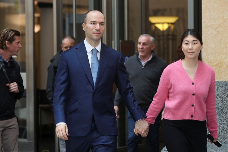 Greg Brockman, president of OpenAI, accompanied by his wife Anna, walks outside a federal courthouse as the trial in Elon Musk's lawsuit over OpenAI's for-profit conversion continues, in Oakland, California, U.S., May 5, 2026. REUTERS/Manuel Orbegozo