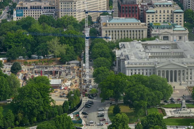 Aerial view from the top of the Washington Monument shows construction crews as they continue site preparation for a planned White House ballroom in the area of the former East Wing in Washington, D.C., U.S., May 2, 2026. REUTERS/Ken Cedeno