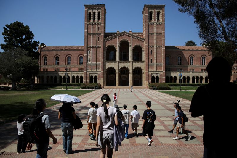 People walk through the campus of the University of California Los Angeles (UCLA) in Los Angeles, California, U.S., August 11, 2025. REUTERS/Daniel Cole
