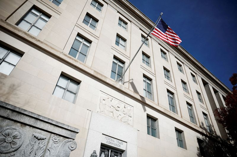 FILE PHOTO: A U.S. flag flutters at the Federal Trade Commission (FTC) headquarters in Washington, D.C., U.S., November 24, 2024. REUTERS/Benoit Tessier/File Photo