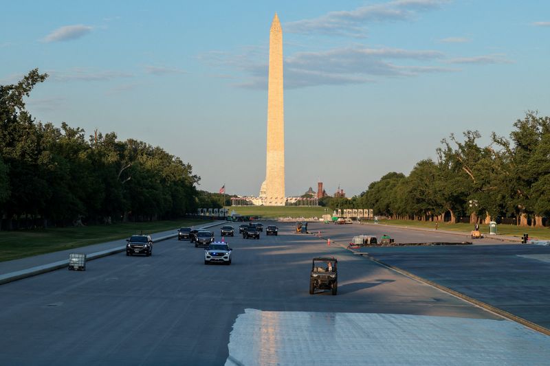 FILE PHOTO: U.S. President Donald Trump's motorcade drives on the Lincoln Memorial Reflecting Pool as it undergoes renovations, with the Washington Monument and U.S. Capitol building in the background, in Washington, D.C., U.S., May 7, 2026. REUTERS/Kylie Cooper/File Photo